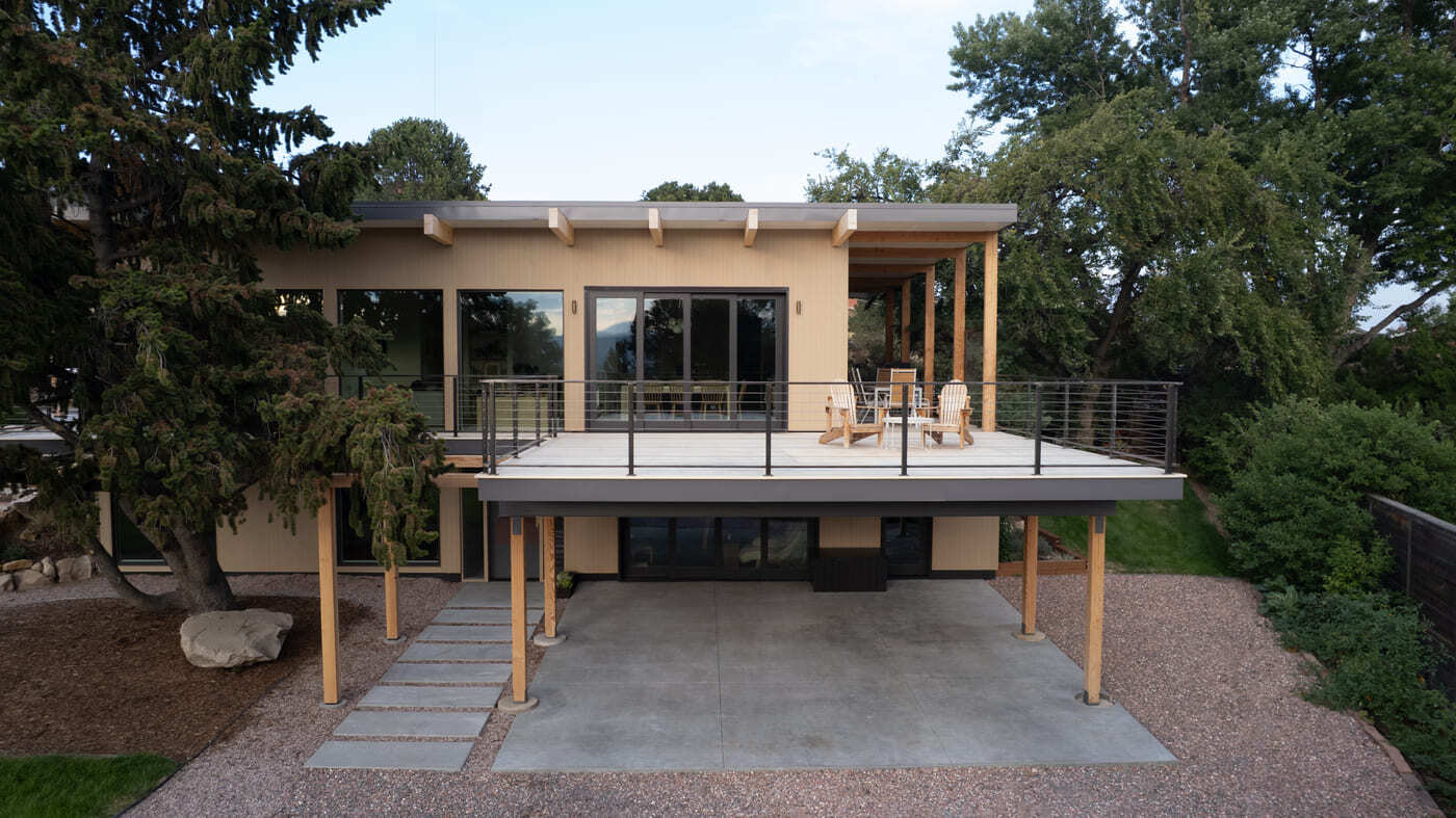 Modern pop top renovation with elevated deck and covered patio in Arvada, CO by Cillessen Construction